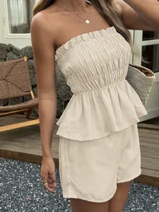 Close-up of a striped smocked strapless peplum top and high-waisted shorts set