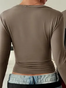 Back view of a brown slim-fit long-sleeved shirt showing its elegant silhouette