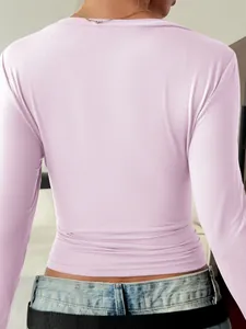 Back view of a slim-fit lavender long-sleeved T-shirt showcasing fabric texture and fit
