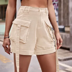 Close-up of high-waisted beige denim cargo shorts with utility pockets and ring straps