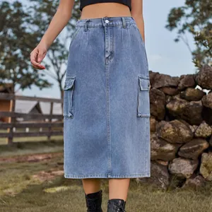 Stylish light wash denim cargo midi skirt with side flap pockets in an outdoor setting