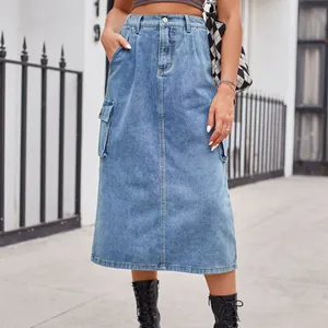 Detailed view of high-waisted washed denim midi skirt with functional cargo pockets.