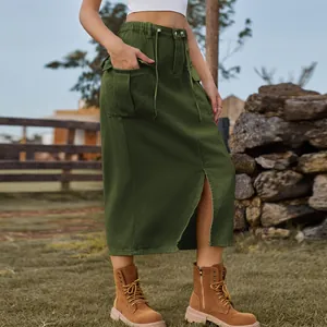 Detailed view of the olive green denim cargo skirt with a front slit and utility pockets.
