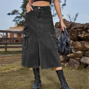 Outdoor shot of a black denim cargo midi skirt with side pockets and front slit