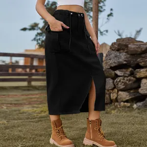 Detail view of a black washed denim cargo midi skirt with a front slit design.