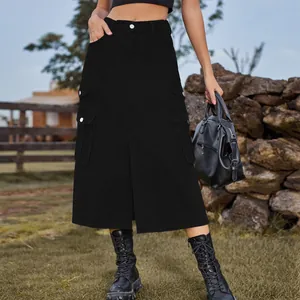 Close-up of a stylish black cargo midi skirt with side pockets and front slit details