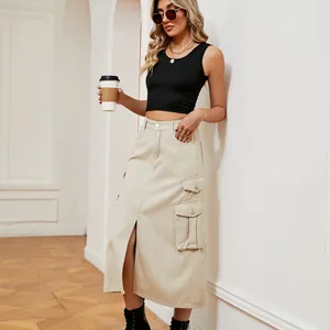 Model wearing a beige high-waisted cargo denim midi skirt with front split and pockets