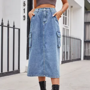 Casual mid-length washed denim cargo skirt with large flap pockets, street style view.