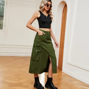 Model wearing army green cargo midi skirt with front slit and functional side pockets