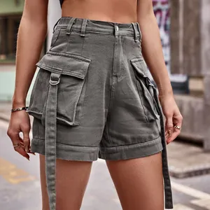Close-up detail of grey denim cargo shorts with functional pockets and stylish straps