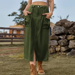Detail of army green cargo denim midi skirt with front slit and utility pockets