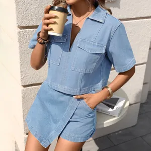 Trendy light blue denim set featuring a V-neck short sleeve top and asymmetric skirt