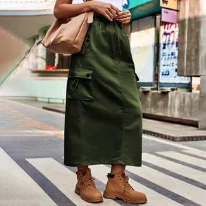 Detailed view of a long olive green cargo skirt with drawstring and side pockets.