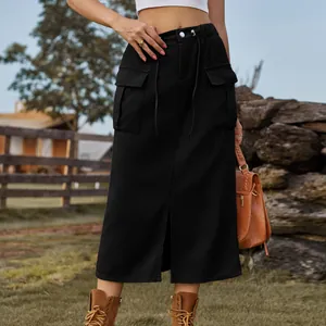 Detail of black denim cargo skirt featuring functional pockets and front split design