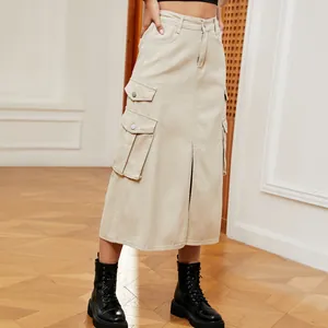 Detailed view of beige cargo midi skirt showing front slit and functional pockets