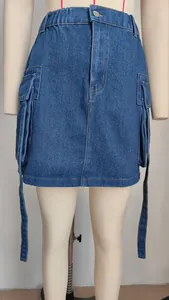 Detailed view of the elastic waist and ribbon straps on a blue denim cargo mini skirt