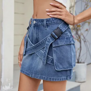 Detailed view of women's denim cargo mini skirt featuring cross-straps and utility buckle