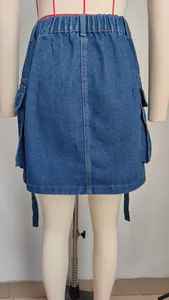 Detailed view of casual blue denim cargo skirt with elastic waist and trailing straps.