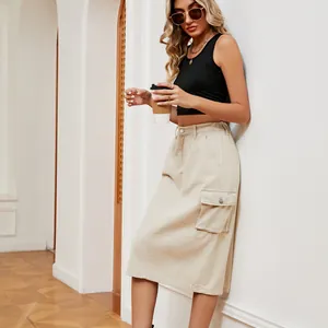 Stylish beige cargo denim midi skirt featuring a side pocket shown on a model
