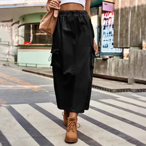 Close-up detail of a black cargo maxi skirt featuring drawstring waist and large side pockets