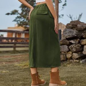 Back view of olive green cargo denim skirt with elastic waist and utility pockets