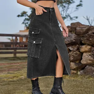 Detail shot of black denim cargo midi skirt featuring front slit and large pockets