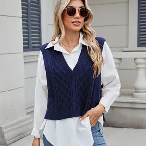 Close-up detail of women's navy blue V-neck cable knit sweater vest with loose fit