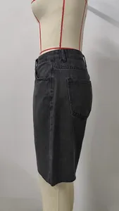 Side view of dark grey washed denim shorts with raw hem on a mannequin