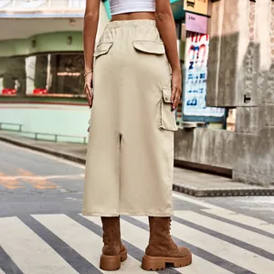 Back view of a khaki cargo midi skirt with a stylish slit and utility pockets