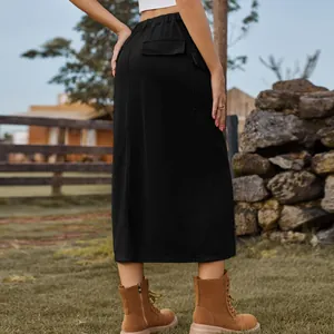Back view of a black cargo denim midi skirt featuring back pockets and elastic waist