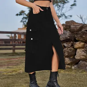 Model wearing black high-waisted cargo midi skirt with front slit in outdoor setting