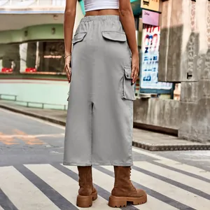 Grey cargo midi skirt with back slit and flap pockets shown from the back view