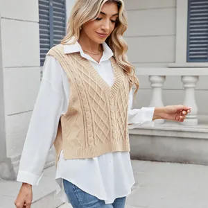 Chic V-neck cable knit sweater vest for women styled over a crisp white button-down shirt.