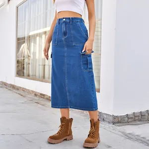 Close-up of a washed denim cargo midi skirt showing pocket detail and durable denim texture.