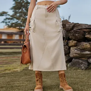 Retro khaki denim cargo midi skirt styled with brown boots and a leather bag.