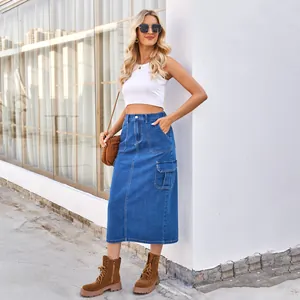 Outdoor street style shot of women's washed denim cargo midi skirt with side pocket