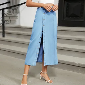 Detail showing light blue denim midi skirt with functional front button-down design.