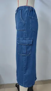 Detail side view of washed blue denim cargo midi skirt featuring large flap pockets