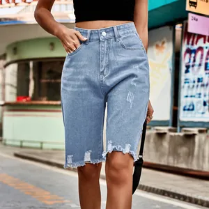 High-waist distressed light blue denim bermuda shorts with raw frayed hem for women