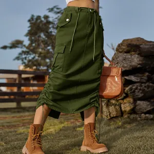 Stylish military green cargo denim midi skirt with drawstring details in outdoor setting.