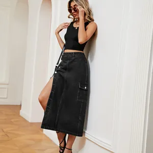 Fashionable high waist black denim cargo midi skirt styled with a black crop top in a room