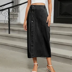 Detail of black cargo denim skirt with front buttons and side pocket