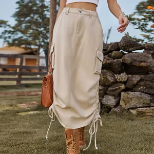 Detailed view of beige cargo maxi skirt with drawstring hem and side pockets