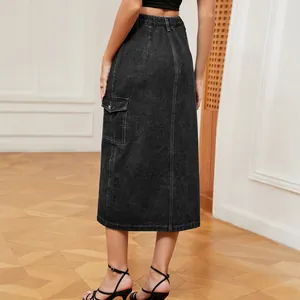 Back view of high waisted black denim midi cargo skirt with large side pocket detail