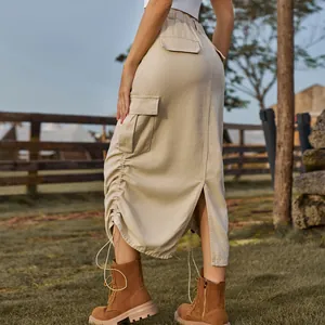 Back view of a beige cargo midi skirt featuring drawstring details and utility pockets