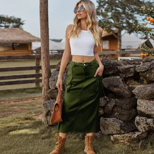 Outdoor model wearing a retro army green denim cargo midi skirt with side pockets