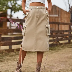 Macro view of beige denim cargo midi skirt with side pockets and decorative drawstring tie