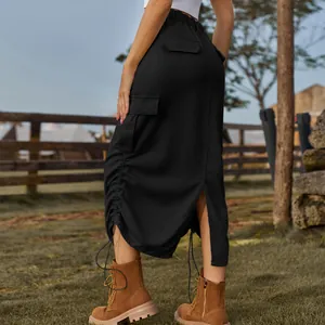 Back detail of a black mid-length cargo skirt with drawstring and side pockets.