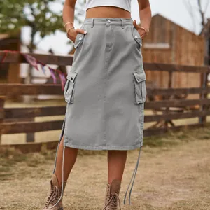 Front detail of a gray cargo midi denim skirt with utility pockets and drawstrings