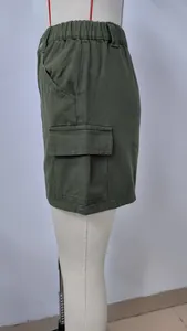 Detailed side view of dark green cargo mini skirt with elastic waist and side pocket